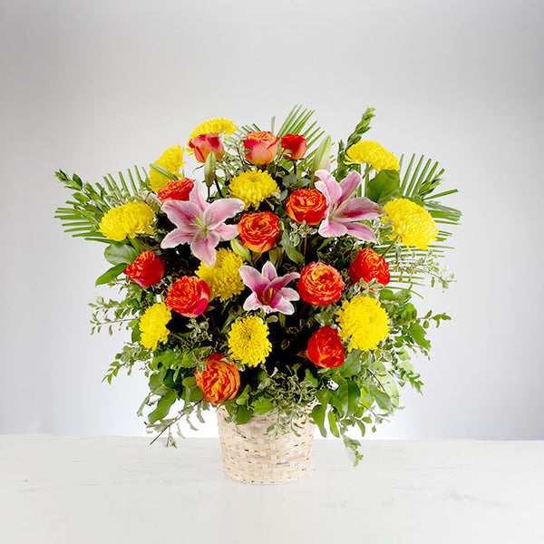 Healing tears basket arrangement in bright color