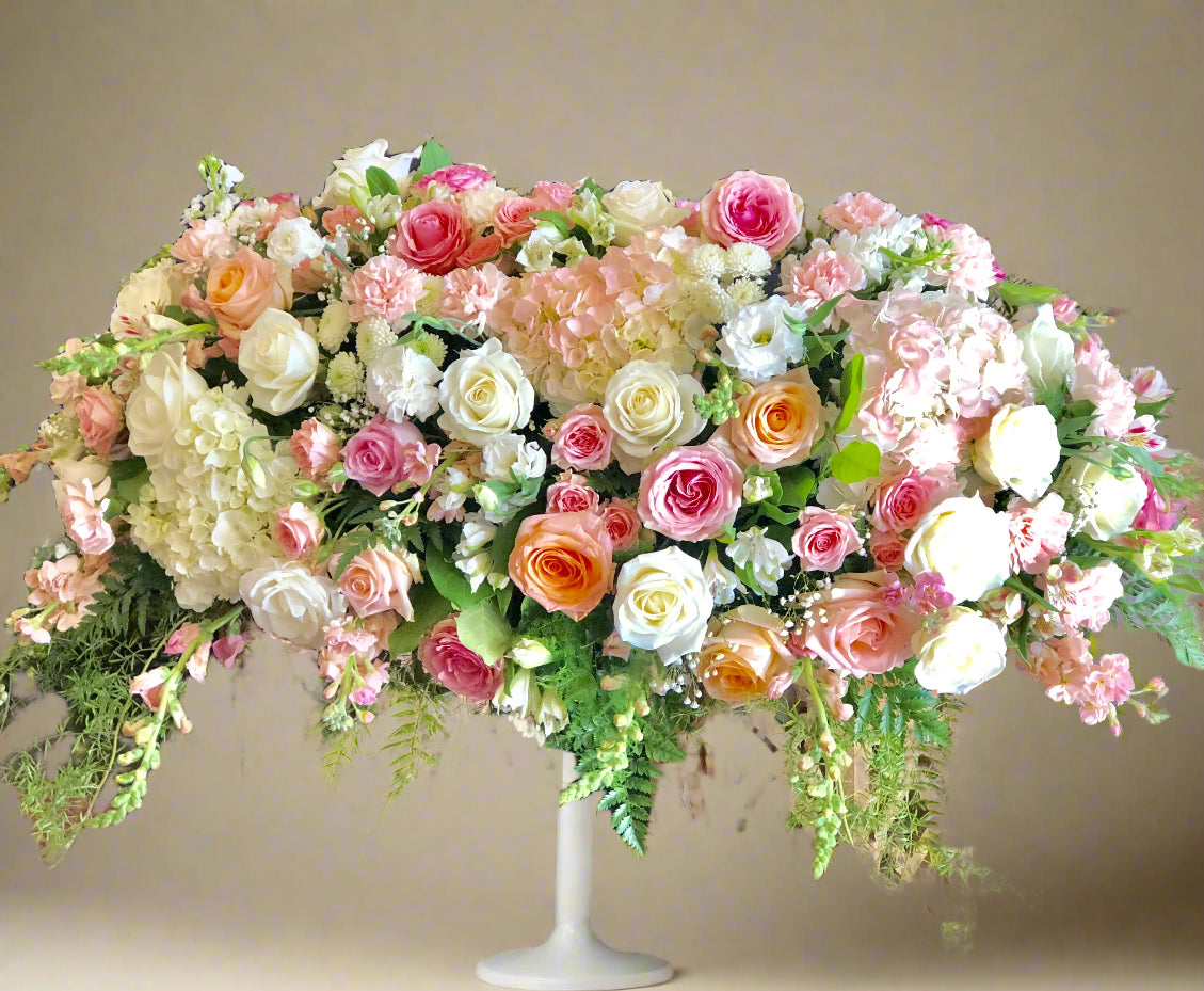 On angels wing large casket spray